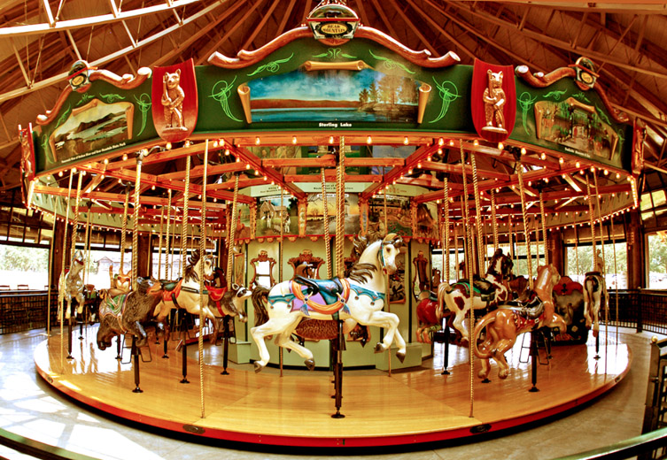 The MERRY-GO-ROUND at Bear Mountain State Park features hand-painted scenes of the Park and 42 hand-carved seats of native animals including black bear, wild turkey, deer, raccoon, skunk, canada goose, fox, swan, bobcat, rabbit, and more.