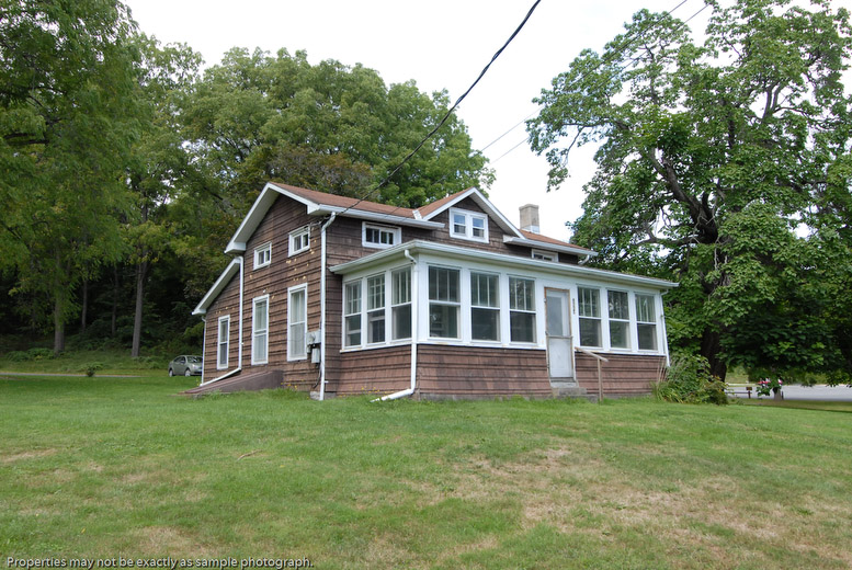 Cayuga Lake State Park Cottage, Finger Lakes Region. The rental cottage at Cayuga Lake State Park is located off Lower Lake Road on Cayuga Lake and is shaded by mature trees. The park provides lake rights, across Lower Lake Road, on the lake. Spacious grounds with picnic tables and a campfire ring adorn the property and a lakefront dock is available for tenants. The cottage has a fully enclosed porch with a view of Cayuga Lake.
Indoor cottage amenities include: a dining room and counter space which seats eight for meals, full kitchen with a stove, microwave, toaster, coffee maker, refrigerator, dishwasher, sink, flatware, plates, glasses, pots, pans, cooking utensils, one and a half baths, heat, hot water/shower, three bedrooms (two with double beds and one with two single beds), wood stove and a sleeper sofa (sleeps two) in the living room. Bedding linen and towels are not provided.
No pets allowed in Full Service Accommodation at Cayuga Lake. No smoking allowed in Full Service Accomodations at Cayuga Lake.
Amenities vary in cabins, so please check in advance of making reservations.