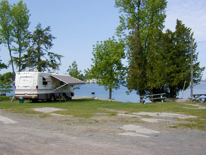 Grass Point State Park is on a point of land that projects into the American Channel of the St. Lawrence River, known for some of the best fishing in the country. The park is a popular spot for campers and day-users, who come to boat, swim, fish, picnic, or just to relax. There is a marina and boat launch, an area is available for games, and the sandy beach and shallow water are excellent for children.Located on the west side of the beach is the Grass Point cottage, a full service accommodation. The two-story cottage has a bathroom with shower, kitchen with refrigerator, stove, microwave, cooking and eating utensils. Bedding, pillows and linen are also provided. The screened-in porch has some outstanding views of the river and sunsets.