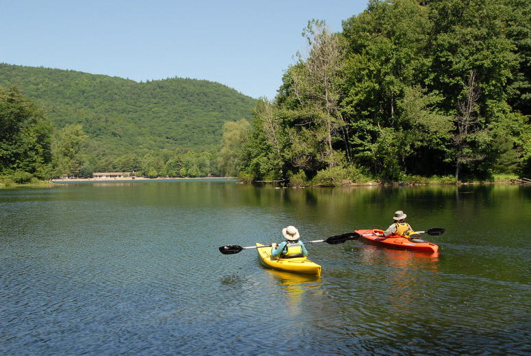Moreau Lake State Park's lake lies amid hardwood forests, pine stands and rocky ridges. Shady groves of trees shelter picnic grounds and a pavilion overlooking the lake. Wooded campgrounds are quiet and secluded, offering facilities for group campers, as well as tent and trailer sites. The sandy beach, nature, hiking and cross-country ski trails, opportunities for boating, fishing and ice fishing, and proximity to the Saratoga Springs and Lake George areas make the park attractive to visitors. A wooden pavilion with a 120-person capacity and three canvas tents, which can accommodate from 35-50 people, may be reserved on a daily basis. In the summer, beach lounges, beach umbrella and fishing gear can be rented. In the winter, snowshoes are available for rent daily.