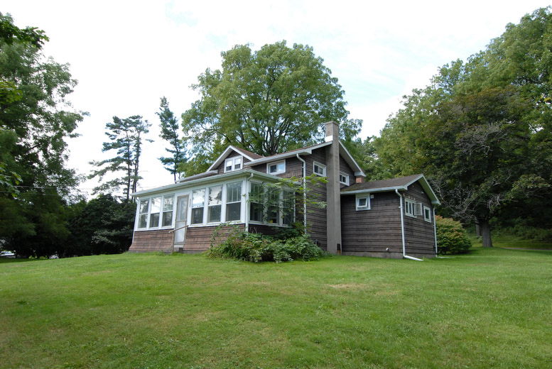 Cayuga lake State Park's vacation rental is located off Lower Lake Road, not much more than a stones throw to Cayuga Lake. The park provides lake rights, across Lower Lake Road, on the lake. Spacious grounds with picnic tables and a campfire ring adorn the property and a lakefront dock is available for tenants. The vacation rental has a fully enclosed porch with a view of Cayuga Lake. Indoor amenities include a dining room and counter space that can seat eight for meals, full kitchen with a stove, microwave, toaster, coffee maker, refrigerator, dishwasher, sink, flatware, plates, glasses, pots, pans, cooking utensils, one and a half baths, heat, hot water/shower, three bedrooms (two with double beds and one with two single beds), washer/dryer and a sleeper sofa (sleeps two) in the living room. Bedding linen and towels are not provided. For further information please contact the park.
